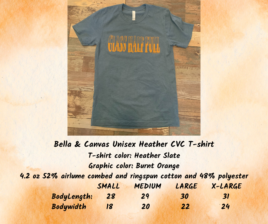 Bella Canvas Unisex Heather CVC T-shirt. Color is heather slate blue with a burnt orange graphic saying "Glass Half Full"