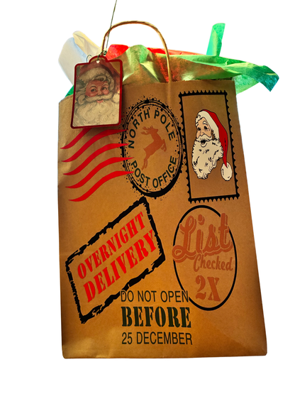 Brown paper bag with Christmas-themed stamps and text, resembling a gift package.